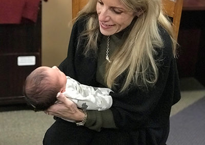 Photos Adoption Expert Mardie Caldwell enjoys holding a newly adopted baby