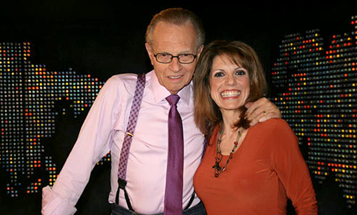 Mardie Caldwell and Larry King pose for a photo after her appearance on Larry King Live