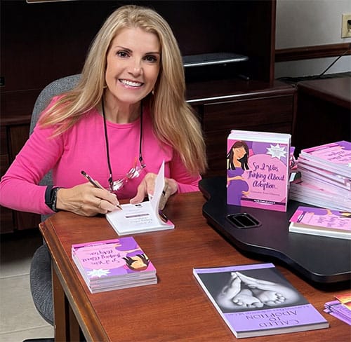 Mardie Caldwell signing her book